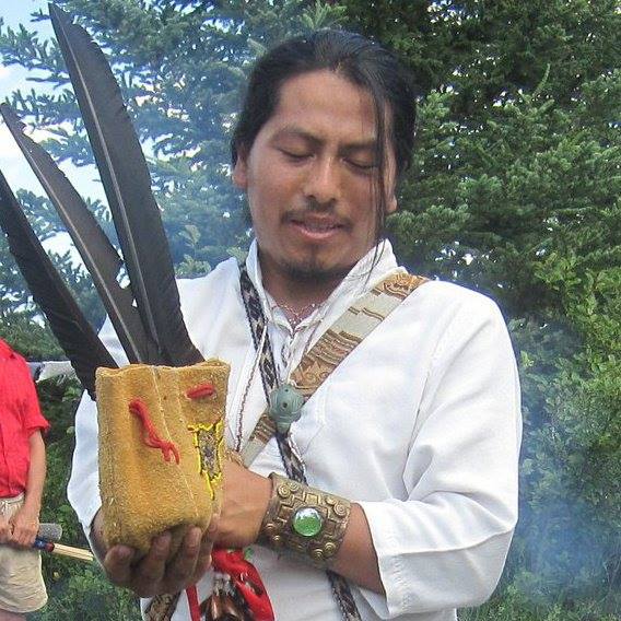 Willak with condor feathers in ceremony.jpg